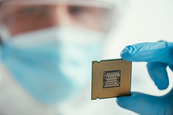 selective-focus-of-engineer-holding-computer-micro-2023-11-27-04-58-29-utc-600x400