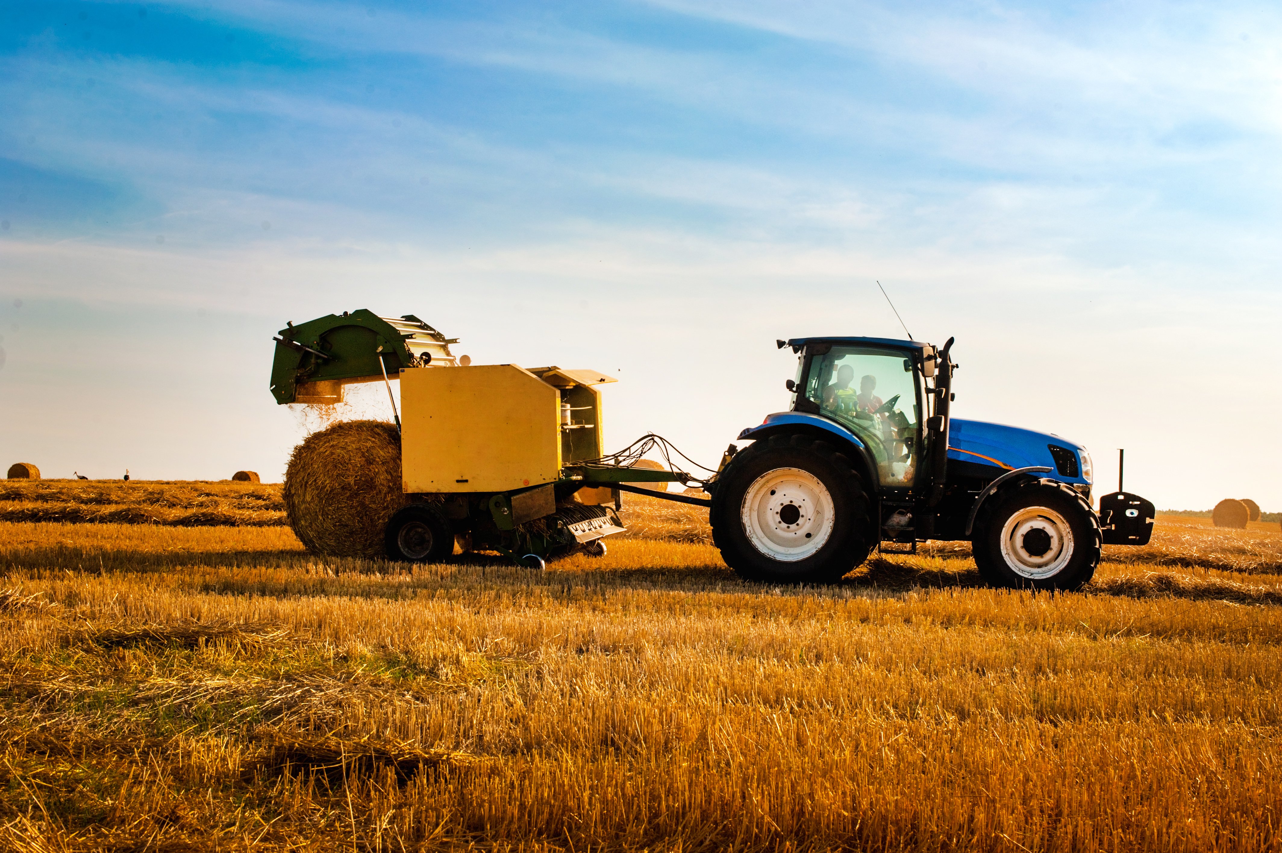 tractor-with-bale-machine-making-large-round-bales-2025-06-15-07-31-34-utc