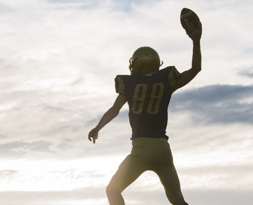 young-american-football-player-about-to-throw-ball-2024-06-13-16-58-11-utc-845x684